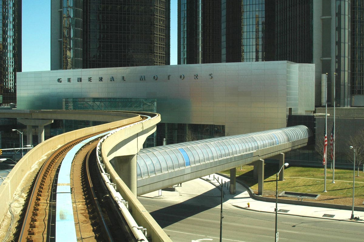 Photo of the exterior of the General Motors building and the Amtrak track in front of it.