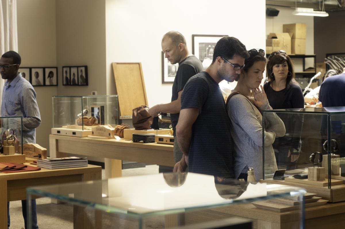 Photo of a crowd browsing the displaying inside a Shinola store