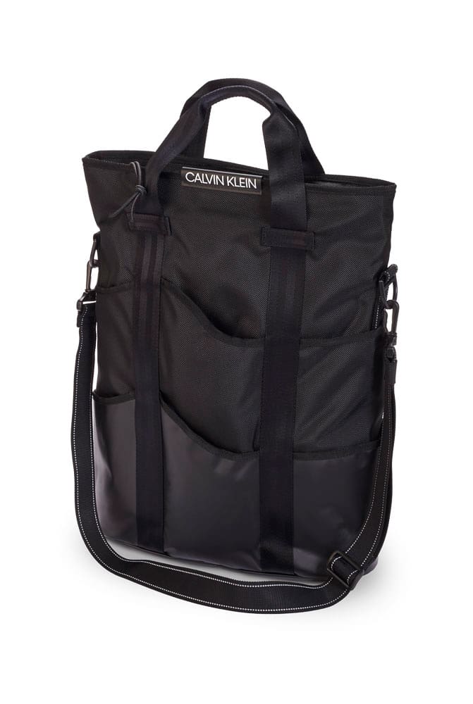 Photograph of a black kevlar Calvin Klein messenger bag