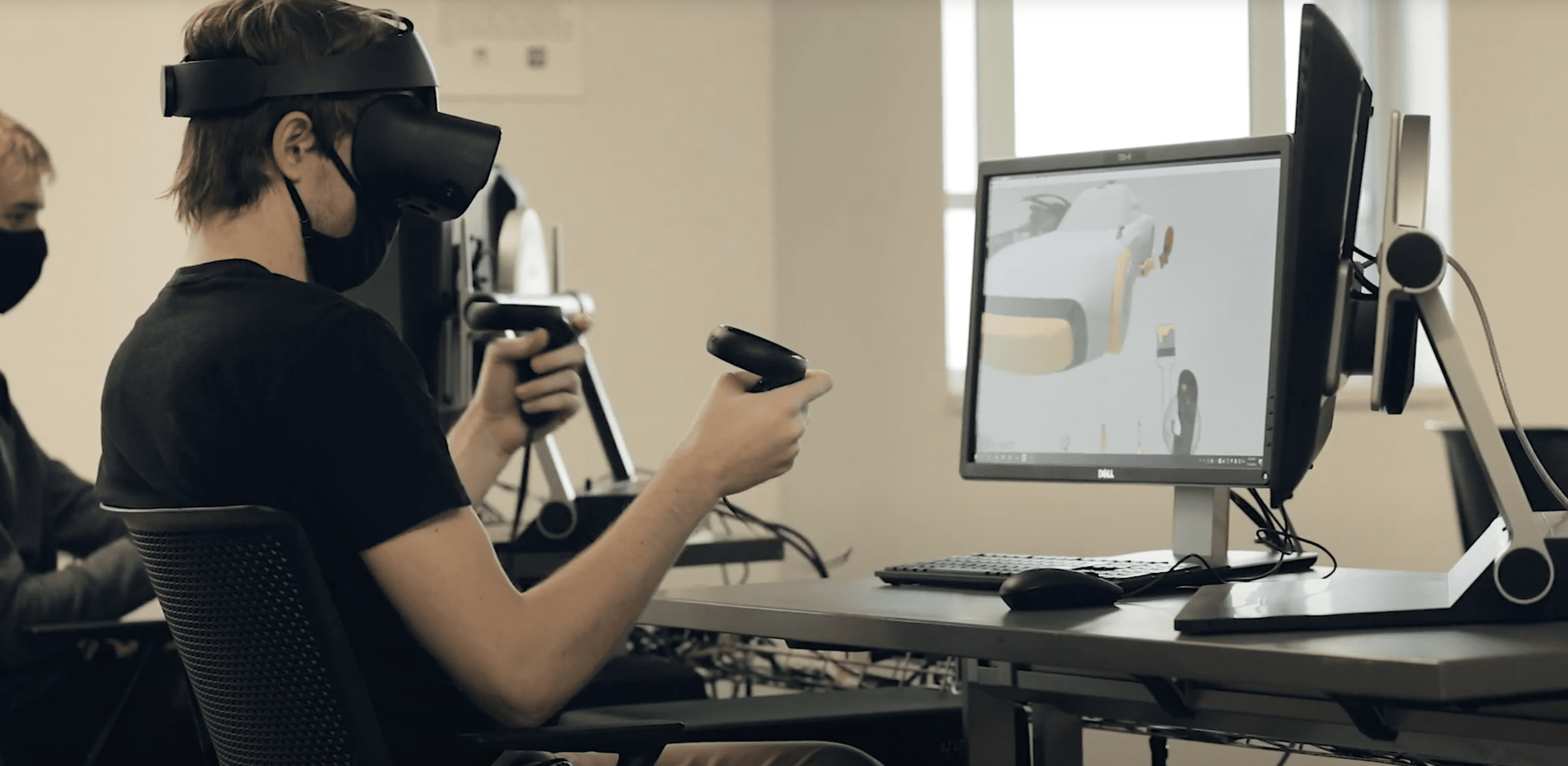 Image of a student wearing a virtual reality headset in class