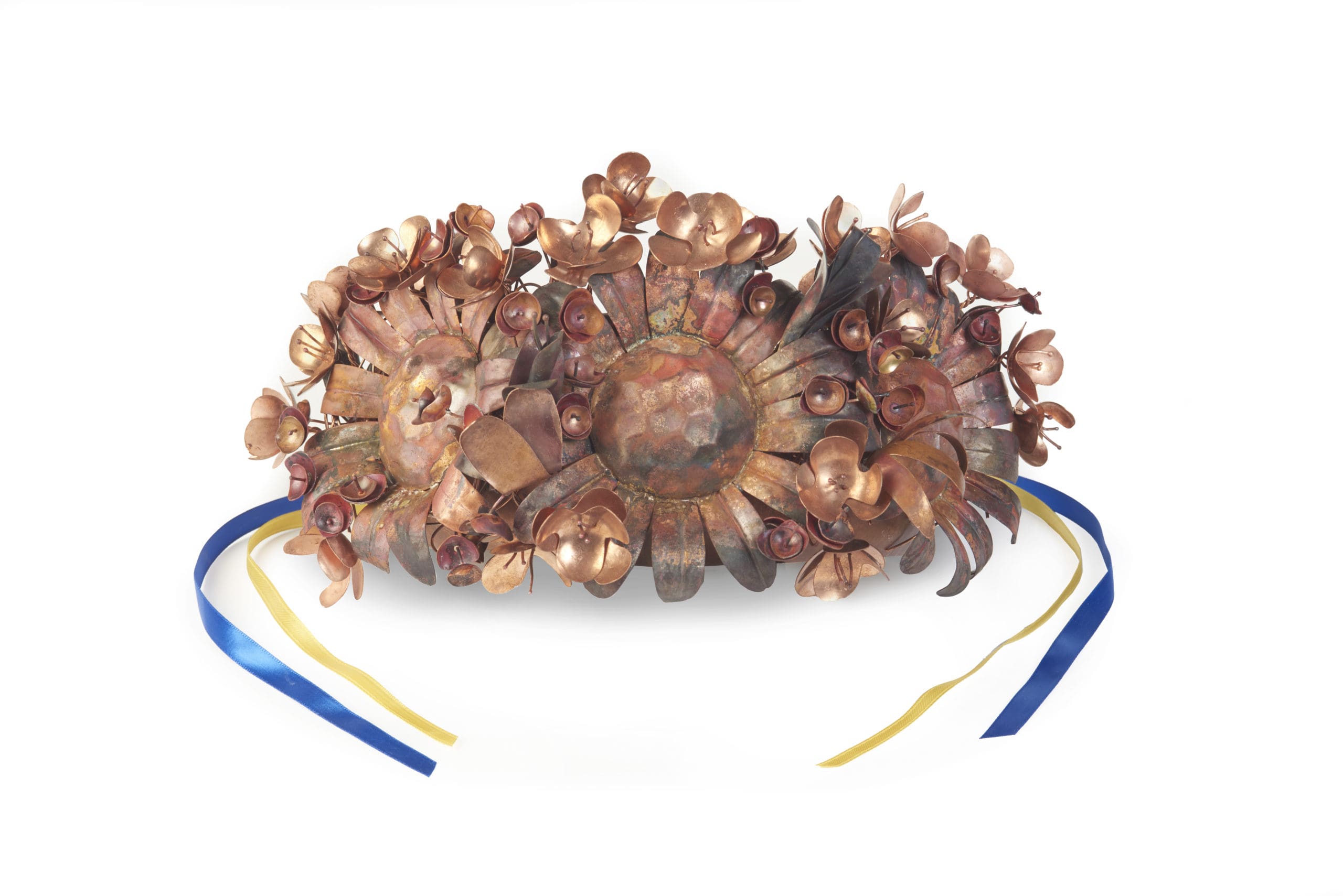 Laura Mooradian, Metalsmithing & Jewelry, copper and ribbon. Copper flowers headdress with blue and yellow ribbons. representing the Ukrainian flag.