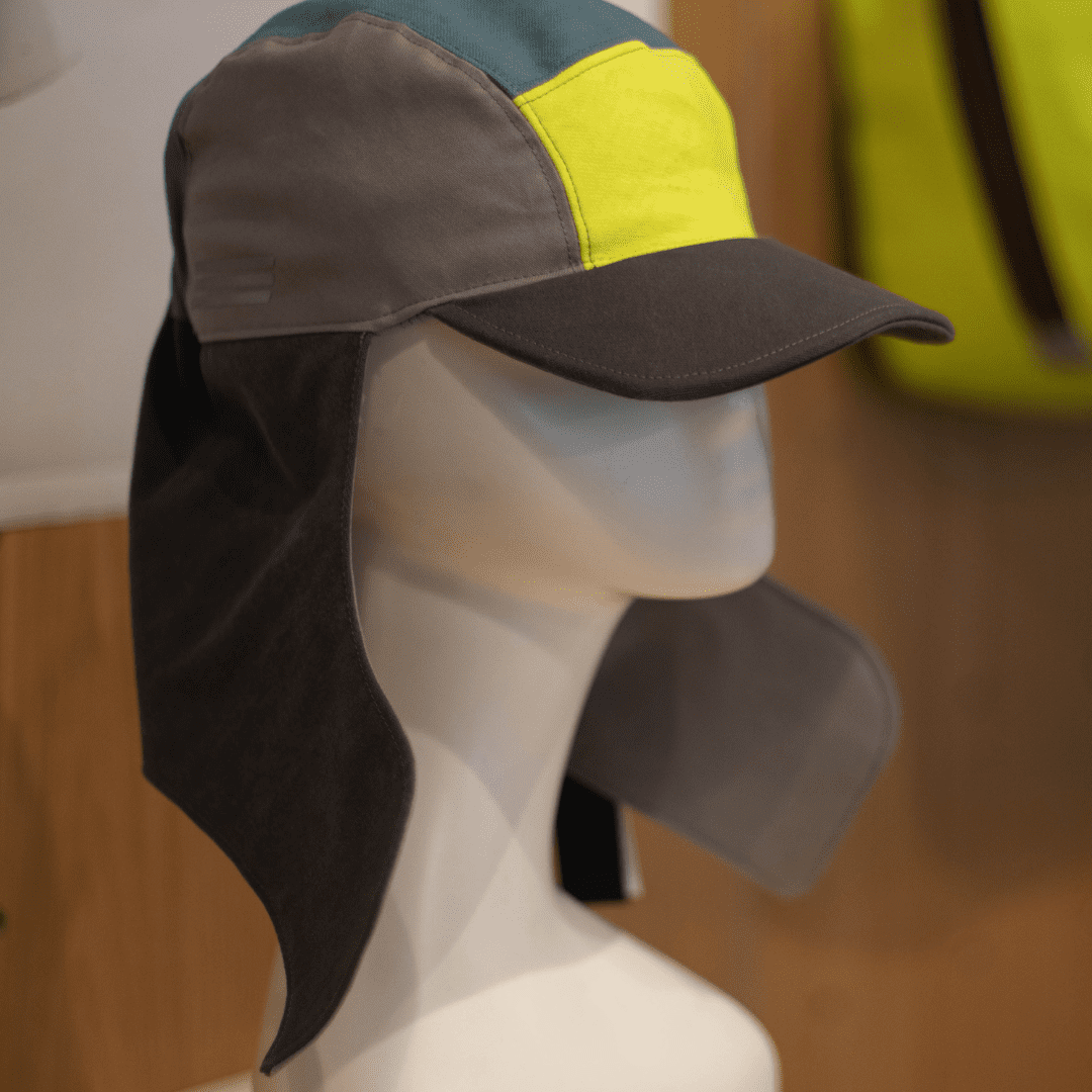 a custom made grey and neon 5 panel hat created by CCS fashion design students