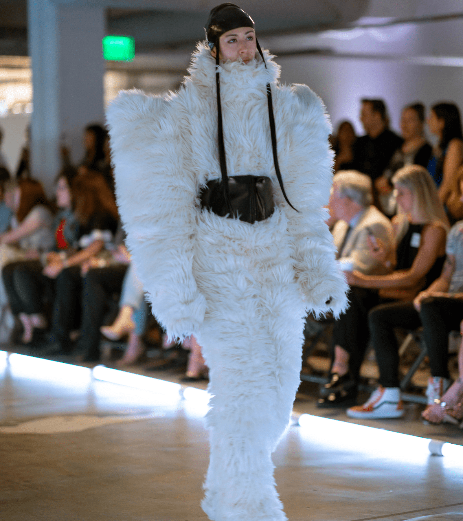 CCS Student modeling fashion apparel on the runway