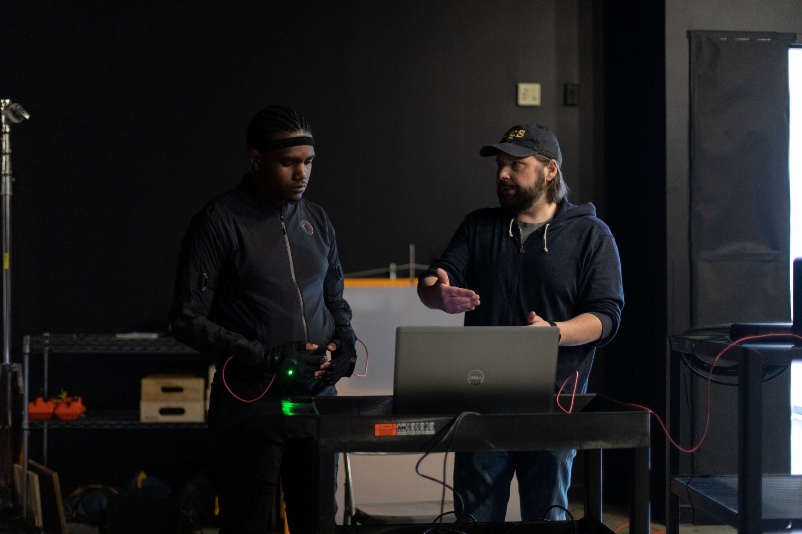 David Gazdowicz working with a student on the computer using new motion capture Rokoko suits
